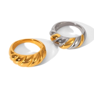 Minimalist croissant rings in gold and two-tone finishes on a light grey background