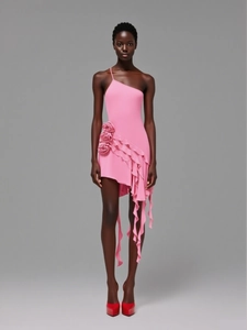 Detail of pink one-shoulder mini dress with 3D floral accents and ruffle layers