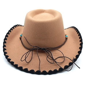 Detail of wool western hat with hand-stitched edges and turquoise beaded leather cord