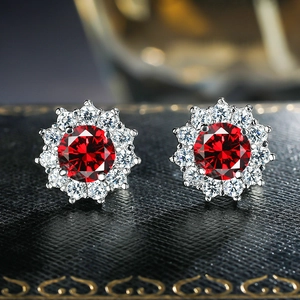 Sunflower shaped silver earrings with red gemstone and white zirconia halo in luxury box