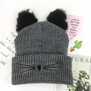 Chic grey knit beanie with cat ears and embroidery on white background