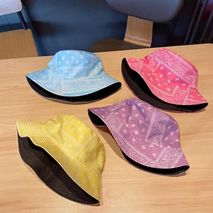 Fashionable paisley print bucket hats in blue, pink, yellow, and purple colors