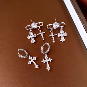 Silver gothic cross hoop earrings with zircon heart and safety pin design details