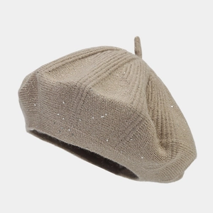 Close-up of beige sequined knit beret showing rabbit fur texture and sparkling details