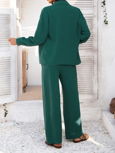 Back view of a green casual two-piece set featuring textured fabric and relaxed fit