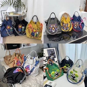 Chic nylon drawstring tote bag with refined embroidery and thick rope handle design