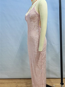 Detail of rose gold sequins on a slim fit backless evening gown with spaghetti straps