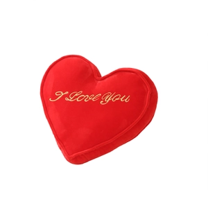 Red heart-shaped plush pillow with gold I Love You embroidery and soft velvet texture