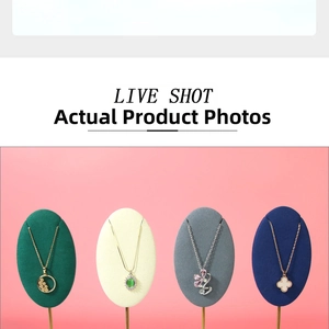 Detail shot of assorted necklaces on velvet jewelry display pads in multiple colors