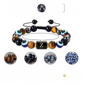 Tiger Eye and Evil Eye hand-woven beaded bracelet with adjustable gold letter Z charm