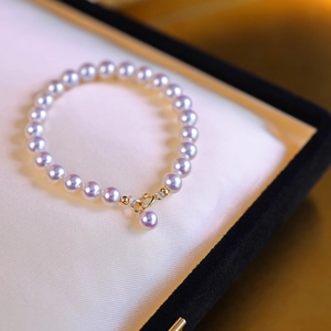 French vintage stainless steel pearl bracelet with elegant gold clasp and lavender luster