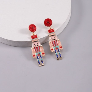 Detailed view of nutcracker earrings with colorful enamel and sparkling rhinestones