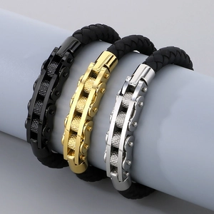 Close-up of mechanical style chain links and woven bands in black, gold, and silver colors