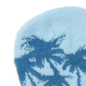 Detail of soft blue plush beanie fabric showing high-density faux mink texture and pattern