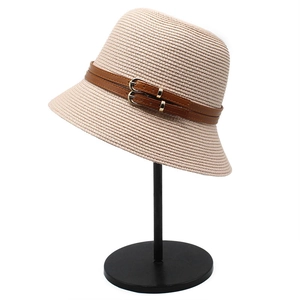 Chic beige straw sun hat for women with brown leather straps and gold buckle detail