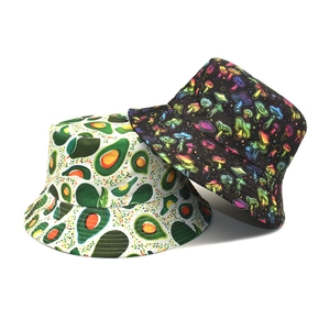 Reversible bucket hat featuring fresh avocado and neon mushroom patterns on canvas material