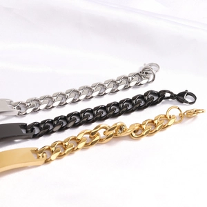 Three Cuban link bracelets in silver, black, and gold on white silk background