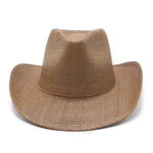 Close-up of brown straw cowboy hat showing detailed weave texture and wide brim