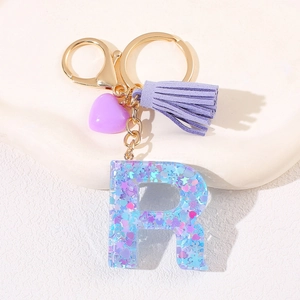 Purple heart resin letter R keychain with gold clasp, leather tassel and glitter sequins