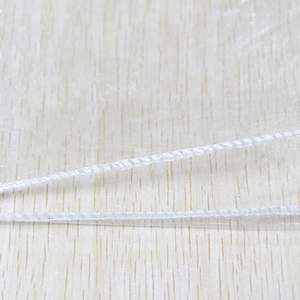 Detailed close-up of white stitched edge craftsmanship on a 0.12mm clear PVC tablecloth