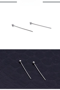 Close-up of silver stainless steel ball head pins for jewelry making and DIY crafts