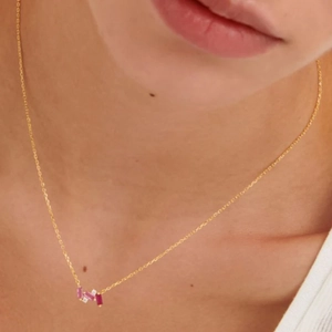 Detail shot of a S925 silver gold necklace featuring colorful rectangular crystal stones