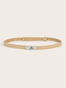Detail of light beige Saffiano leather belt featuring a silver metal turn-lock buckle