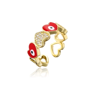 Detail of gold evil eye heart ring with red enamel and pavé zircon settings