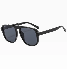 Detail of black aviator sunglasses featuring double bridge frame and silver rivet accents