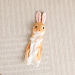 Close-up of soft plush bunny pencil case showing realistic texture and details