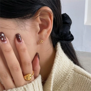 Elegantly minimalist gold twisted heart ring and stud earrings set for casual luxury