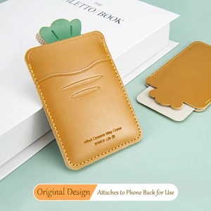 Creative carrot shaped leather phone card holder with slogan on light green background