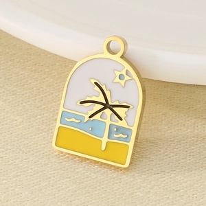 Detail of golden enamel pendant featuring a coconut tree, sea beach and sunset design