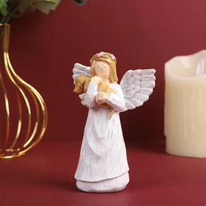 European style resin angel sculpture holding a brown dog with white wings and floral crown