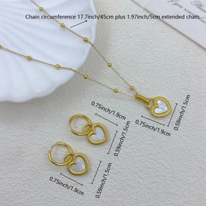 Detailed view of 18K gold heart necklace and earrings with shell inlay and size labels