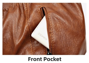 Detail view of the brown leather handbag's front zipper pocket storing a power bank