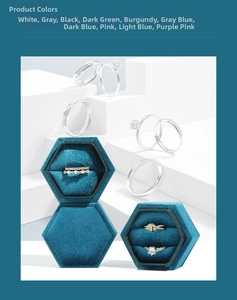 Close-up of hexagonal velvet jewelry boxes in ten colors with silver rings