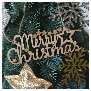 Wooden Merry Christmas ornament with gold star on tree branch in festive setting