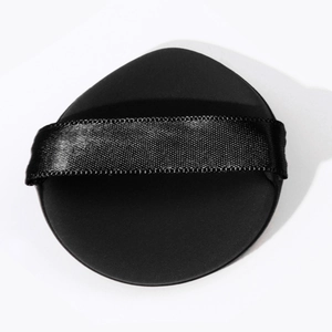 Close-up of black round hairbrush with a wide woven handle on a clean white background