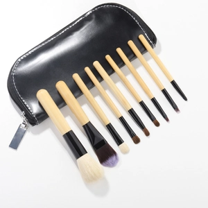 Detailed view of 9-piece wool makeup brush set with wooden handles and a black PU pouch