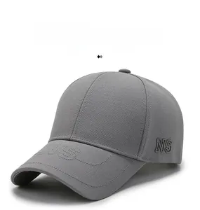 Detailed view of grey baseball cap showing 3D NS embroidery and textured knit fabric