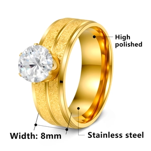 Detail of 8mm stainless steel gold ring with six-claw zircon and matte finish