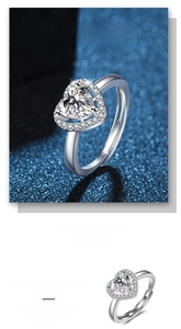 Macro detail of S925 sterling silver heart ring showing the 925 hallmark and sparkling stones