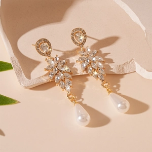 Elegant gold drop earrings with leaf-shaped crystals and a teardrop faux pearl pendant
