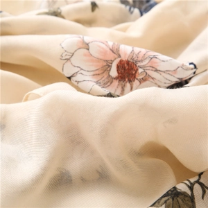 Close-up of cream floral cotton linen scarf featuring soft textures and pink flower patterns