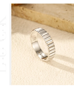 Macro shot of S925 sterling silver industrial ring with embossed prism texture