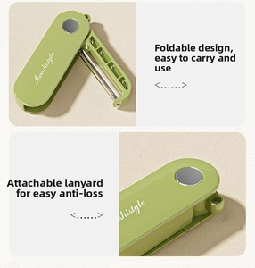 Close-up of portable folding peeler showing sharp metal blade and green handle design