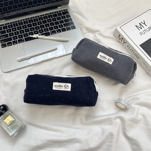 Minimalist wool polka dot pencil case with soft fabric texture and zipper closure for students