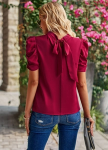 Detail of wine red bubble sleeve blouse with back bow tie knot and soft fabric texture