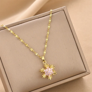 Collier flocon de neige rotatif doré avec zircons roses et chaîne élégante en or